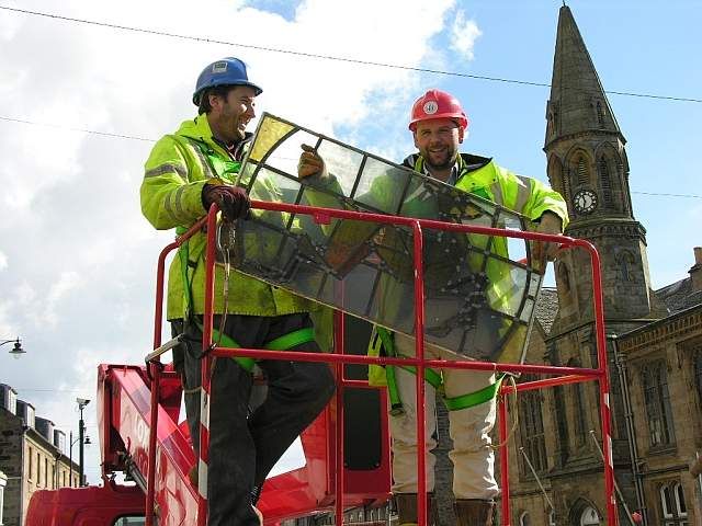 Douglas Spiers of Fife Council with colleague retrieving a window panel Douglas Spiers of Fife Council with colleague retrieving a window panel